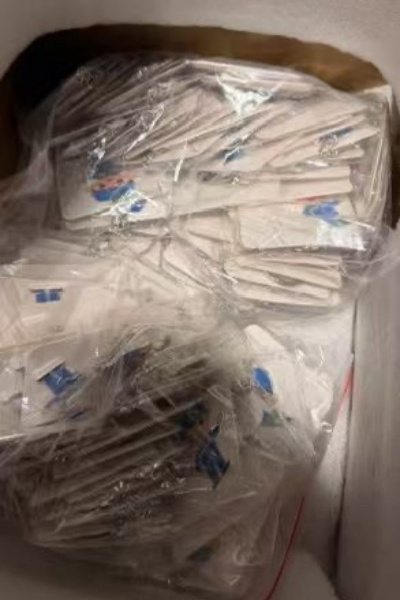 Bagged custom keychains prepared for a bulk order