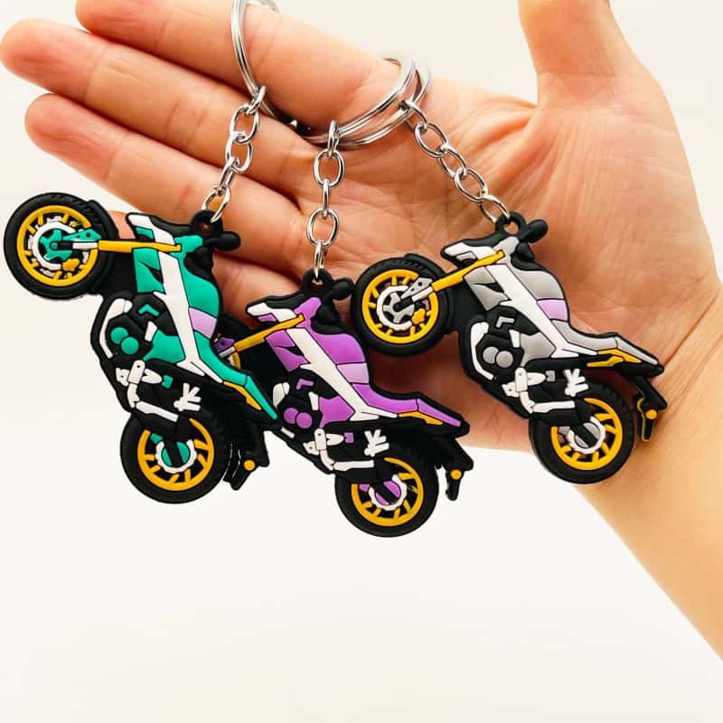 Custom motorcycle PVC keychain sample held for factory approval