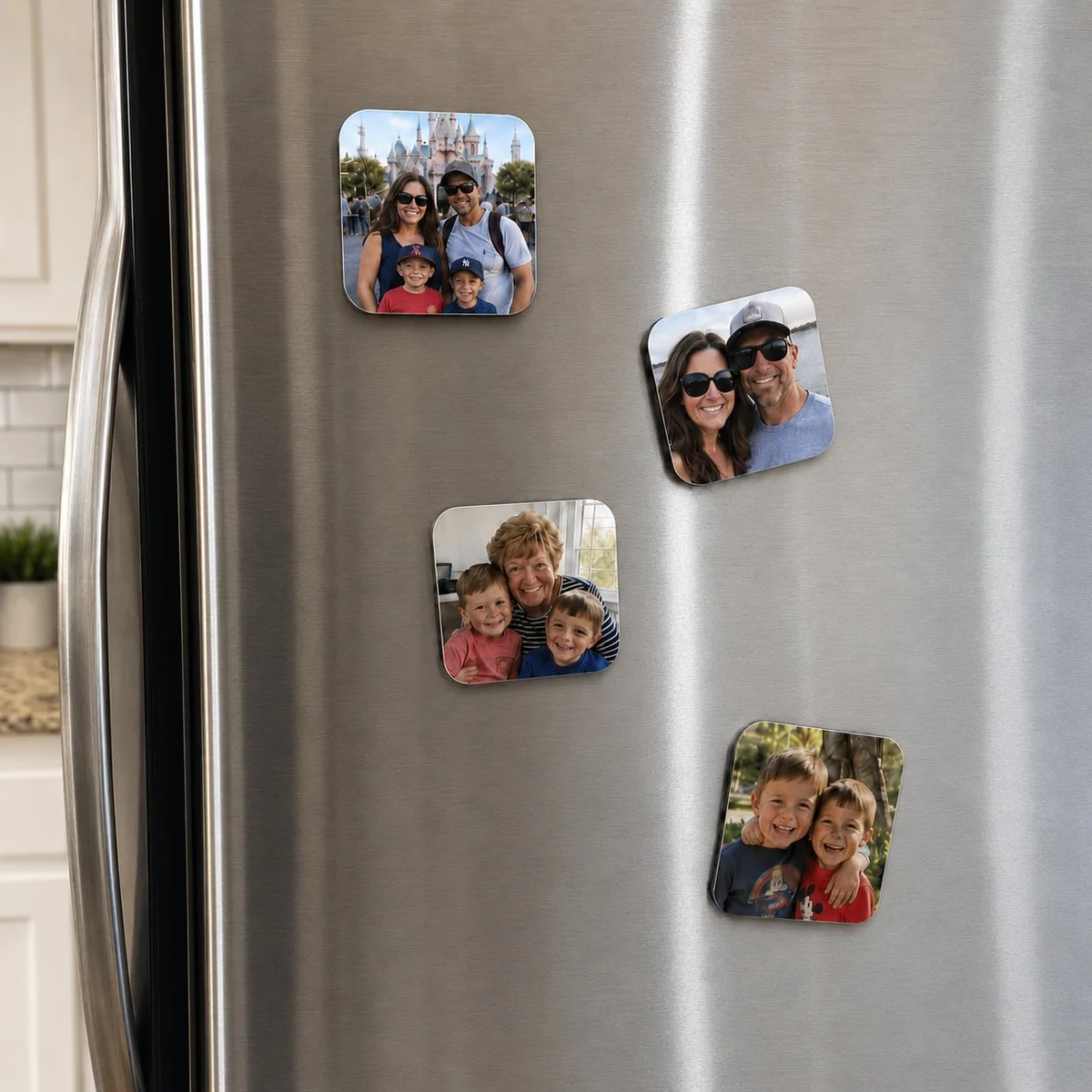 Custom photo fridge magnets displayed on a stainless steel refrigerator