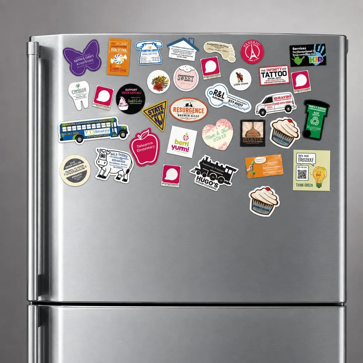 Fridge covered with various custom business magnets for trades and services