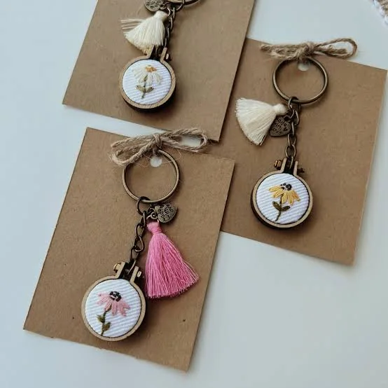 Custom keychains secured to kraft backing cards