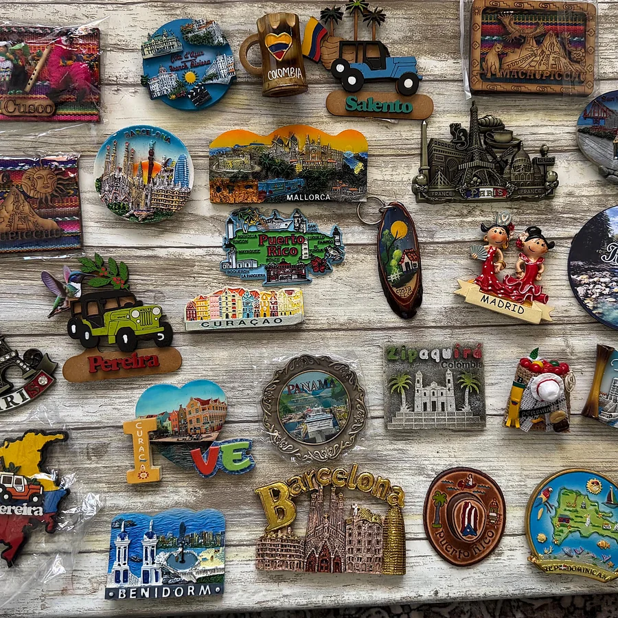 Souvenir fridge magnets showing mixed materials and finishes