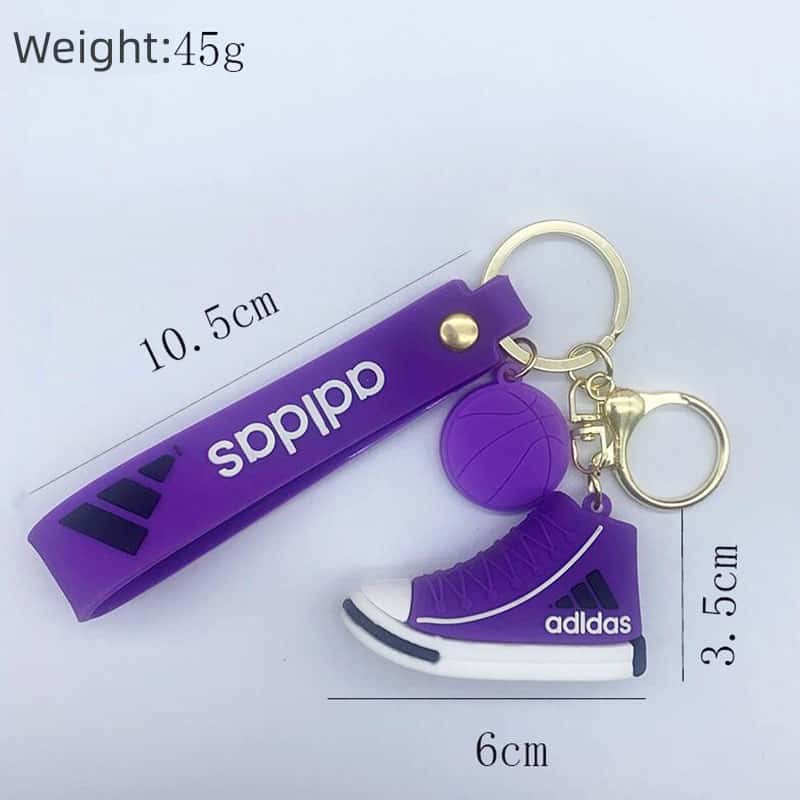 Adidas mini shoe keychain size chart: a 6 cm high-top sneaker and a 10.5 cm wrist strap with a 45 g weight callout