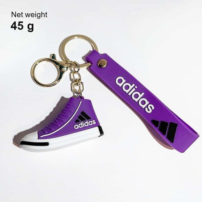Adidas mini shoe keychain net weight: 45 g with the wrist strap, the split ring and the clasp on