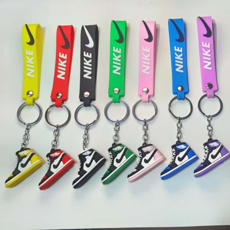 Air Jordan keychains in stock colours on a display rack, each piece carrying its matching swing tag