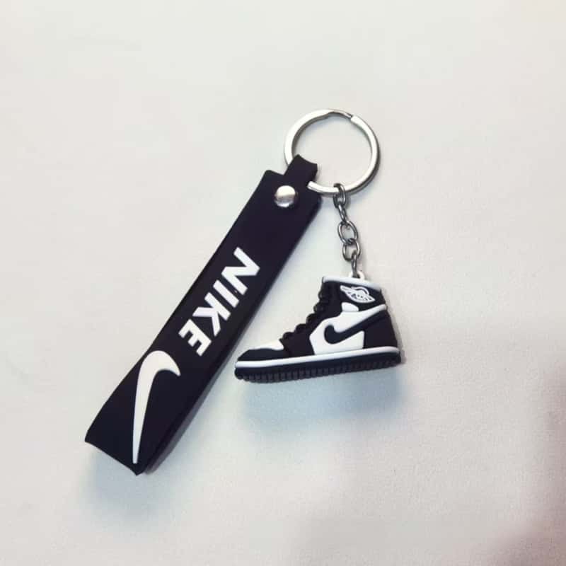 Air Jordan keychain with the black swing tag, showing the printed tag that carries a buyer logo