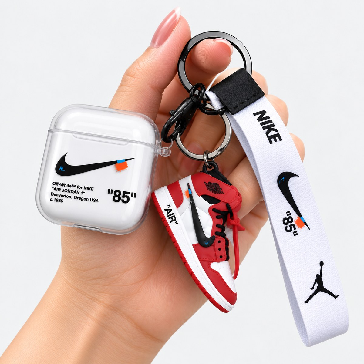AirPod case with shoe keychain angled view showing lanyard clip