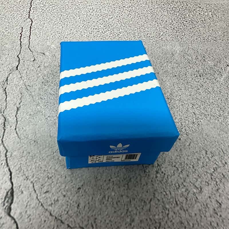 A closed printed two-piece gift box used for packing basketball shoe keychains in matched pairs