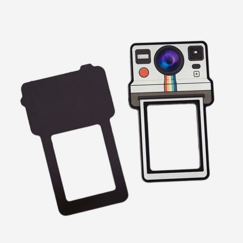 Acrylic panel and flexible magnetic backing of the camera photo magnet, shown apart
