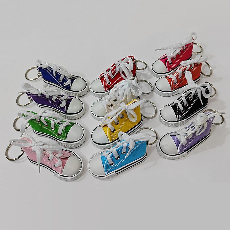 Custom canvas shoe keychain assortment showing the full stock color range