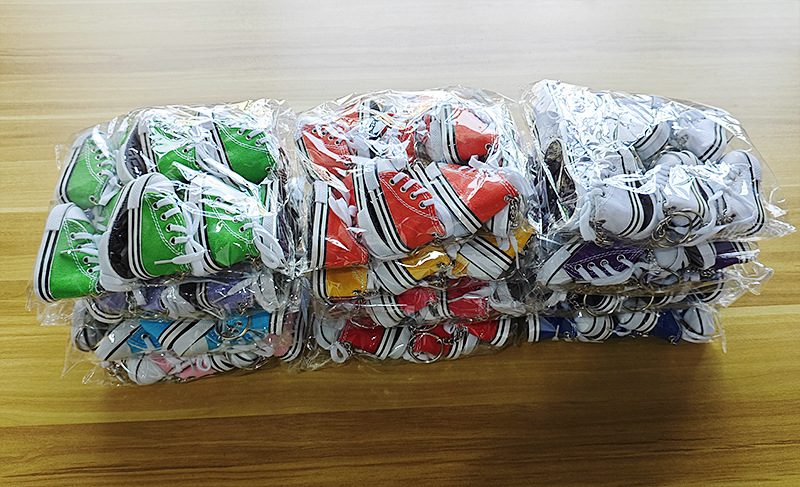 Bulk mini canvas shoe keychains packed one piece per OPP bag