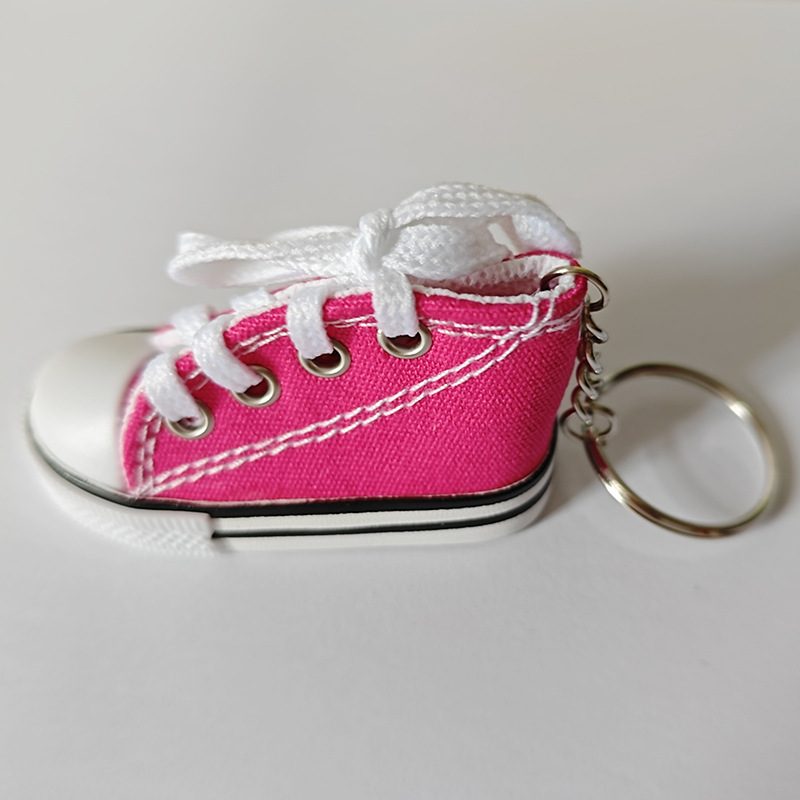 Rose red mini canvas shoe keychain showing the silver split ring and short chain