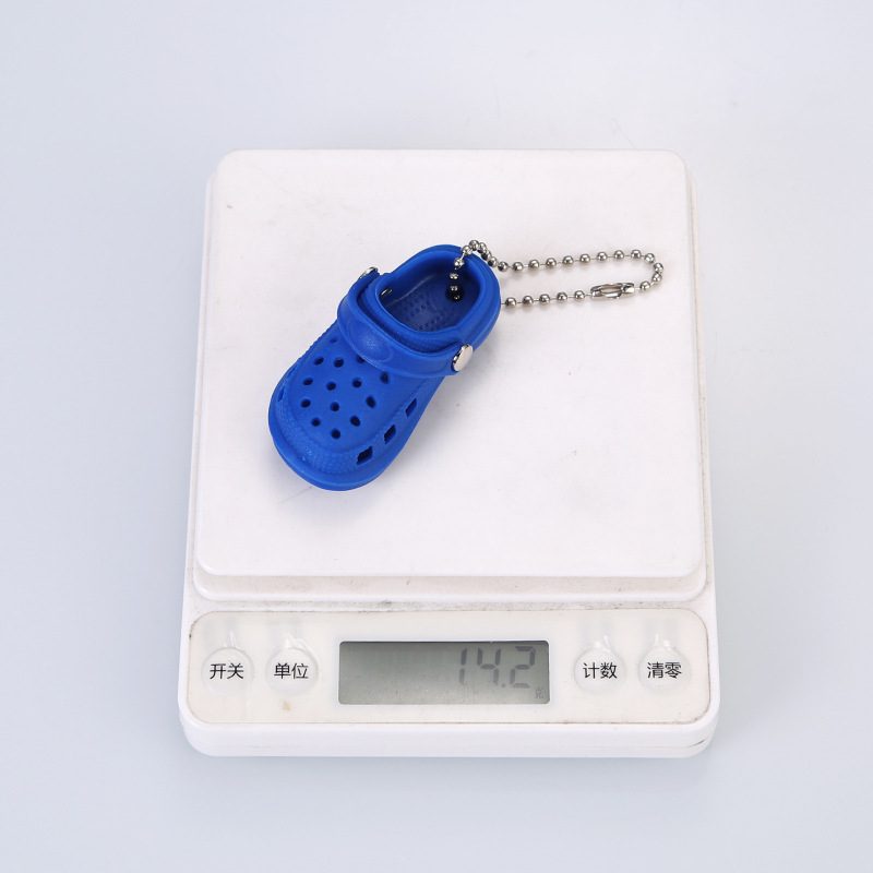 Custom realistic clog keychain on a digital scale, 14.2 g per piece