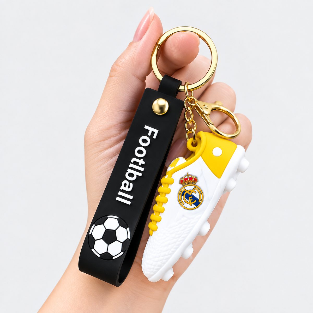 Yellow and white football shoe keychain with club crest detail
