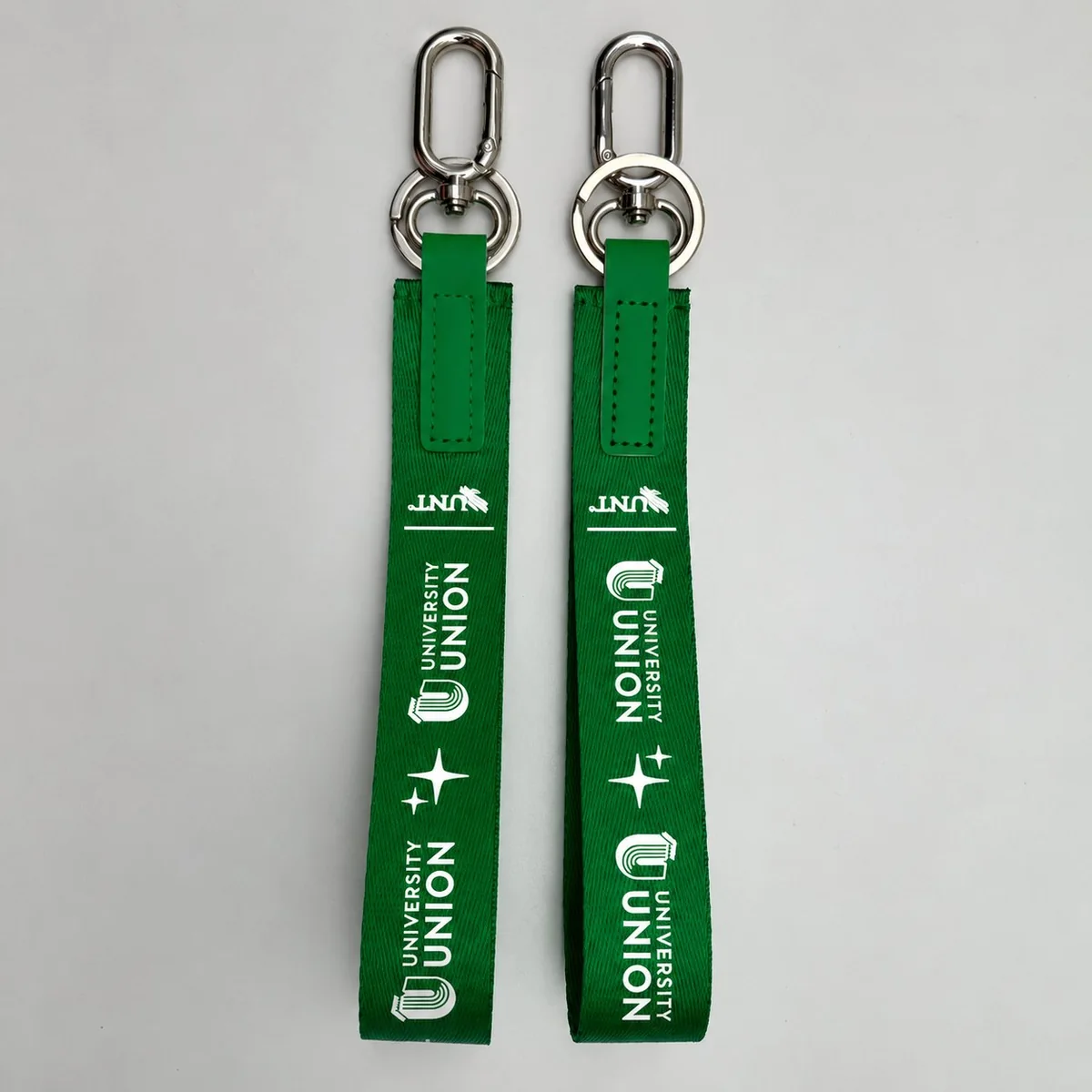 Green University Union fabric lanyard keychain — a soft fabric strap with woven branding and a silver carabiner