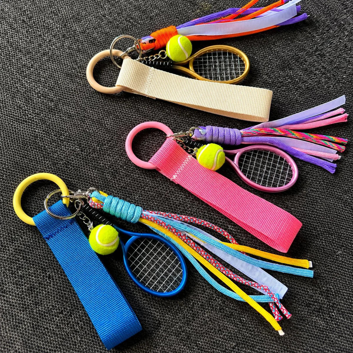 Pile of colorful sports-themed keychains