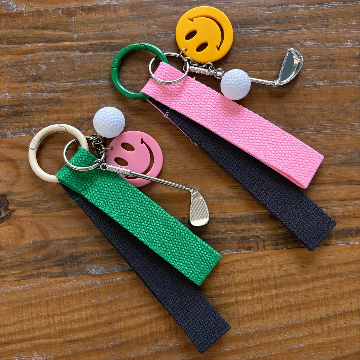 Golf keychain with a pink and green strap