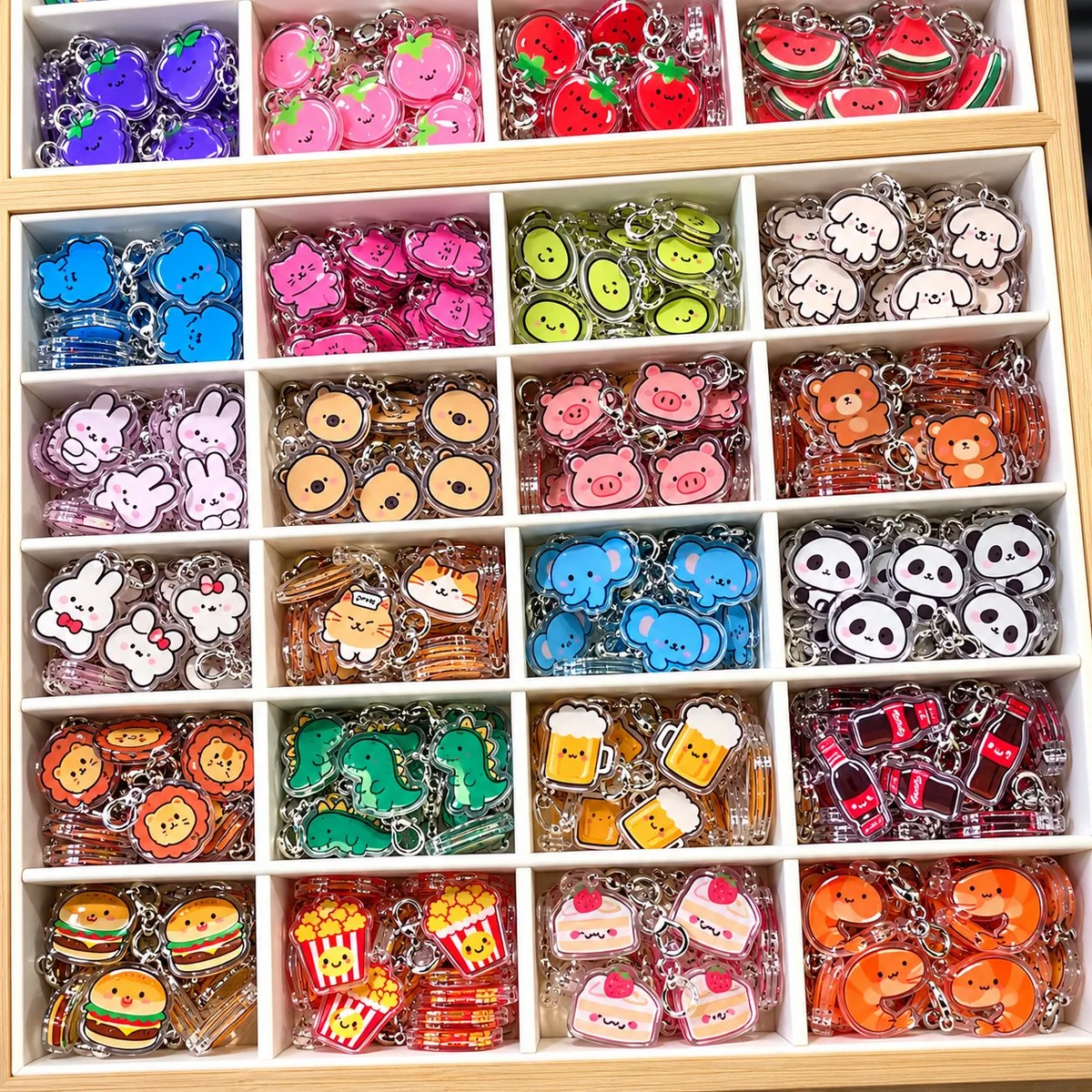 Kawaii acrylic charms: a wooden tray filled with animal