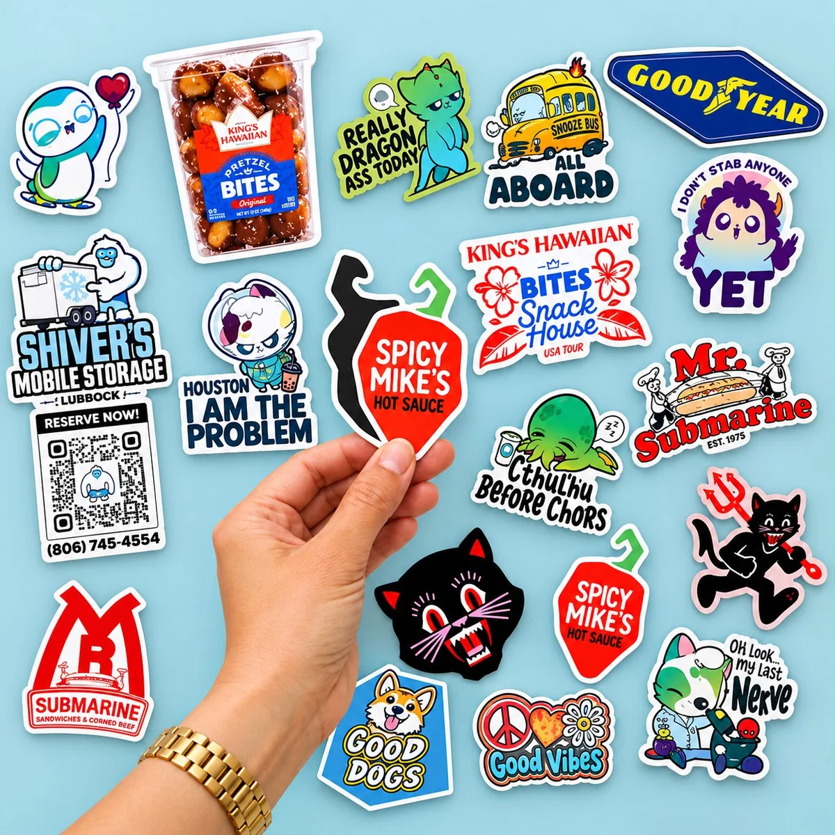 Hand holding a QR code business fridge magnet for a restaurant next to a collection of brand die-cut magnets
