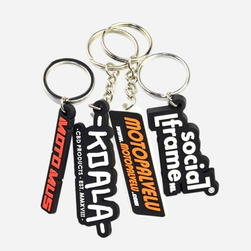 Promotional rubber keychains printed with company logos for trade shows and corporate gifts