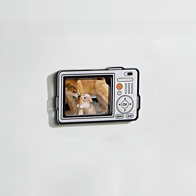 Silver rangefinder camera fridge photo magnet with a photo