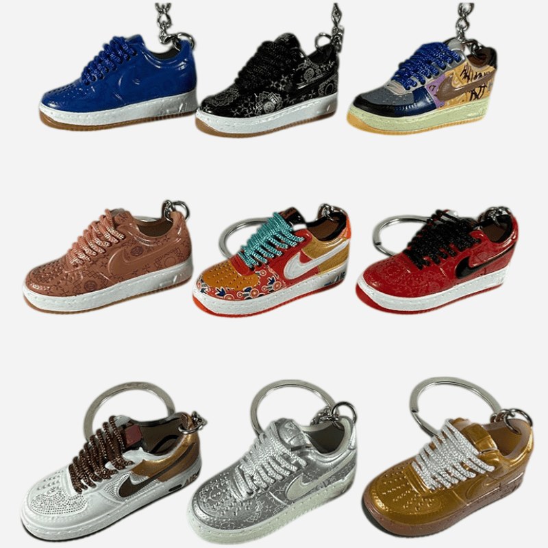 Sneaker keychain models from the same workshop lined up in a grid, showing the range of silhouettes we mould in house