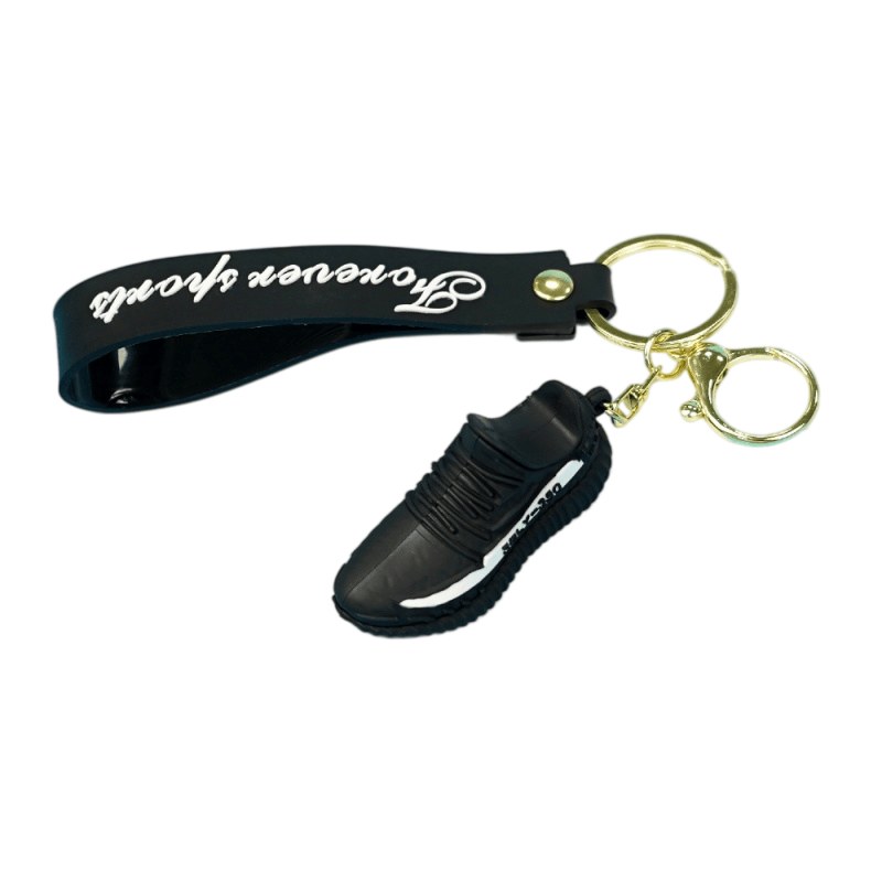 Yeezy shoe keychain in black on a black printed tag strap with a gold-tone split ring