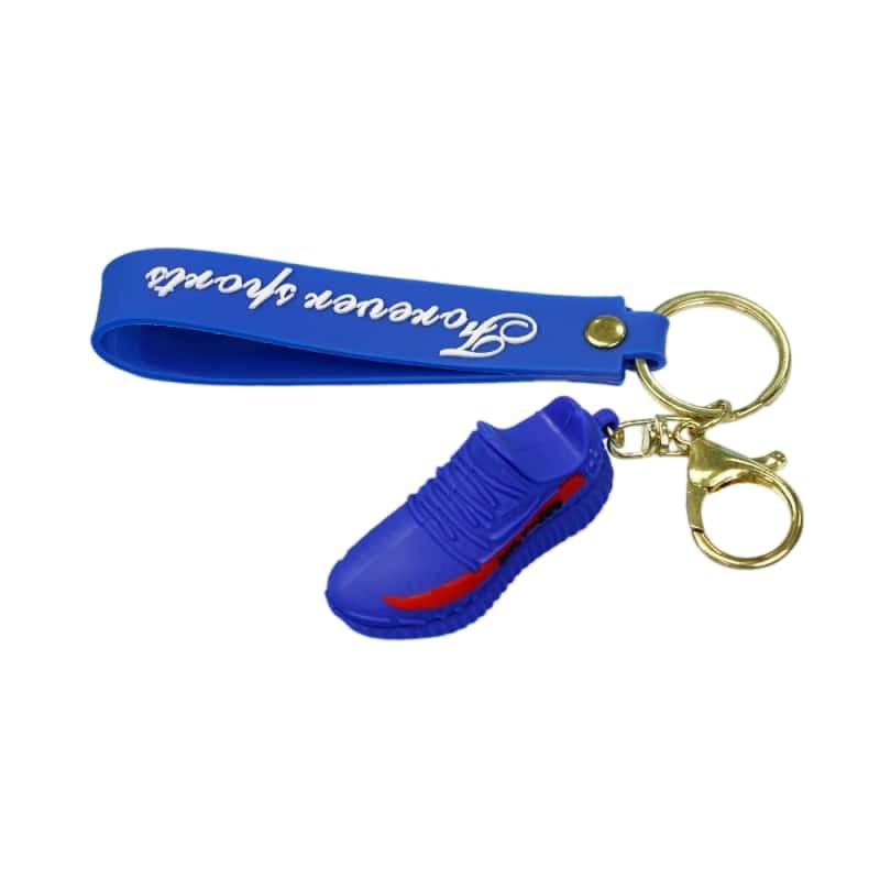 Yeezy shoe keychain pair in blue and red on a blue printed tag strap with a gold-tone ring