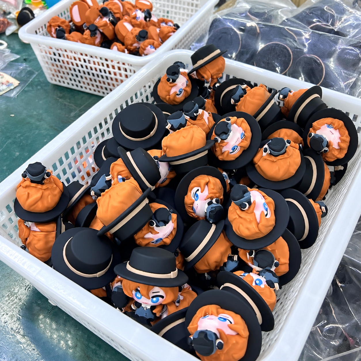 Large basket filled with identical character keychains during bulk production