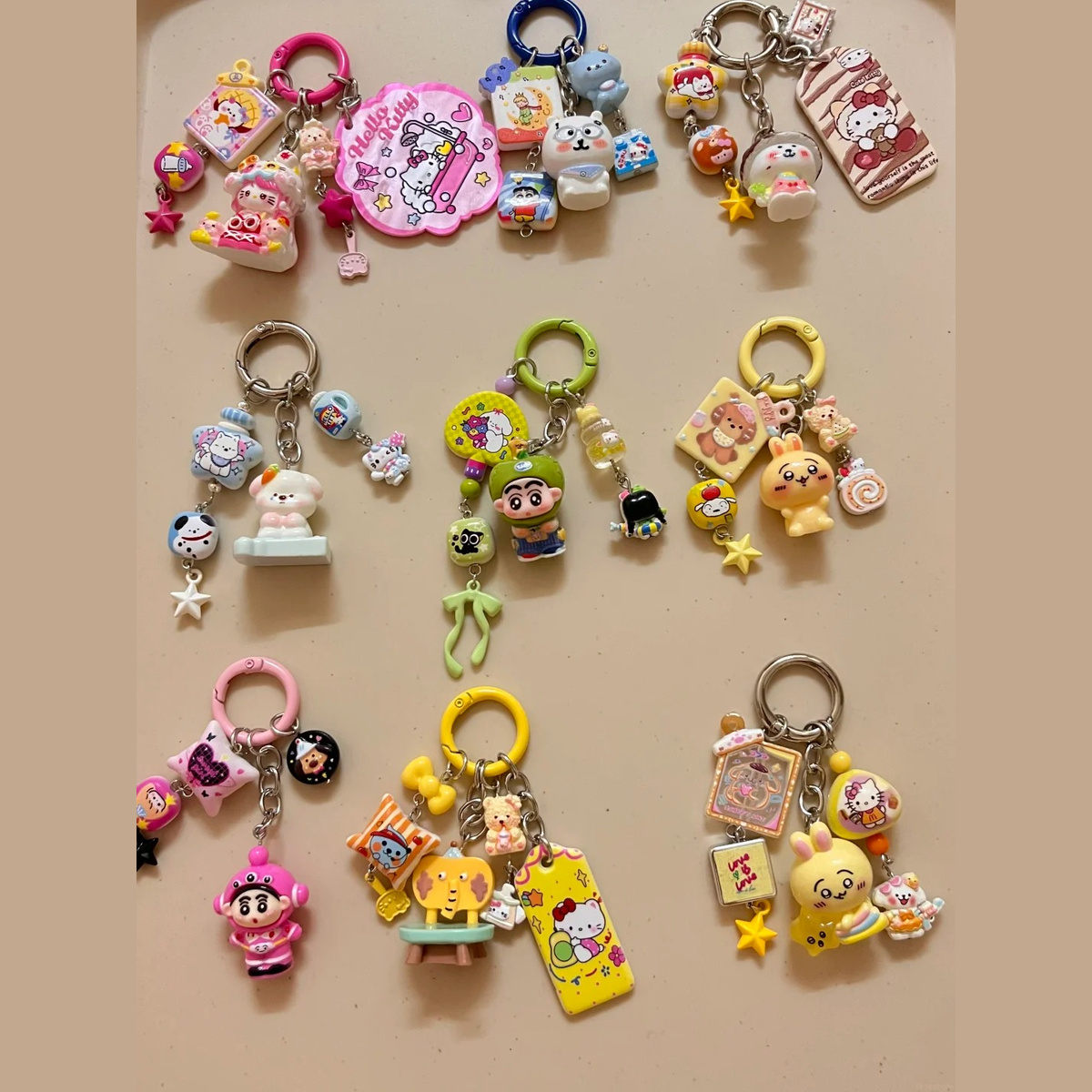 Assorted colorful charm keychains arranged on a tabletop