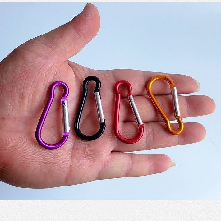 Hand Holding Gourd Carabiners