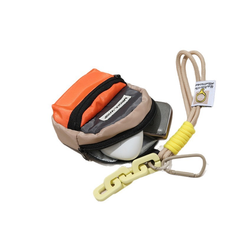 keychain pouch holding wireless earbuds