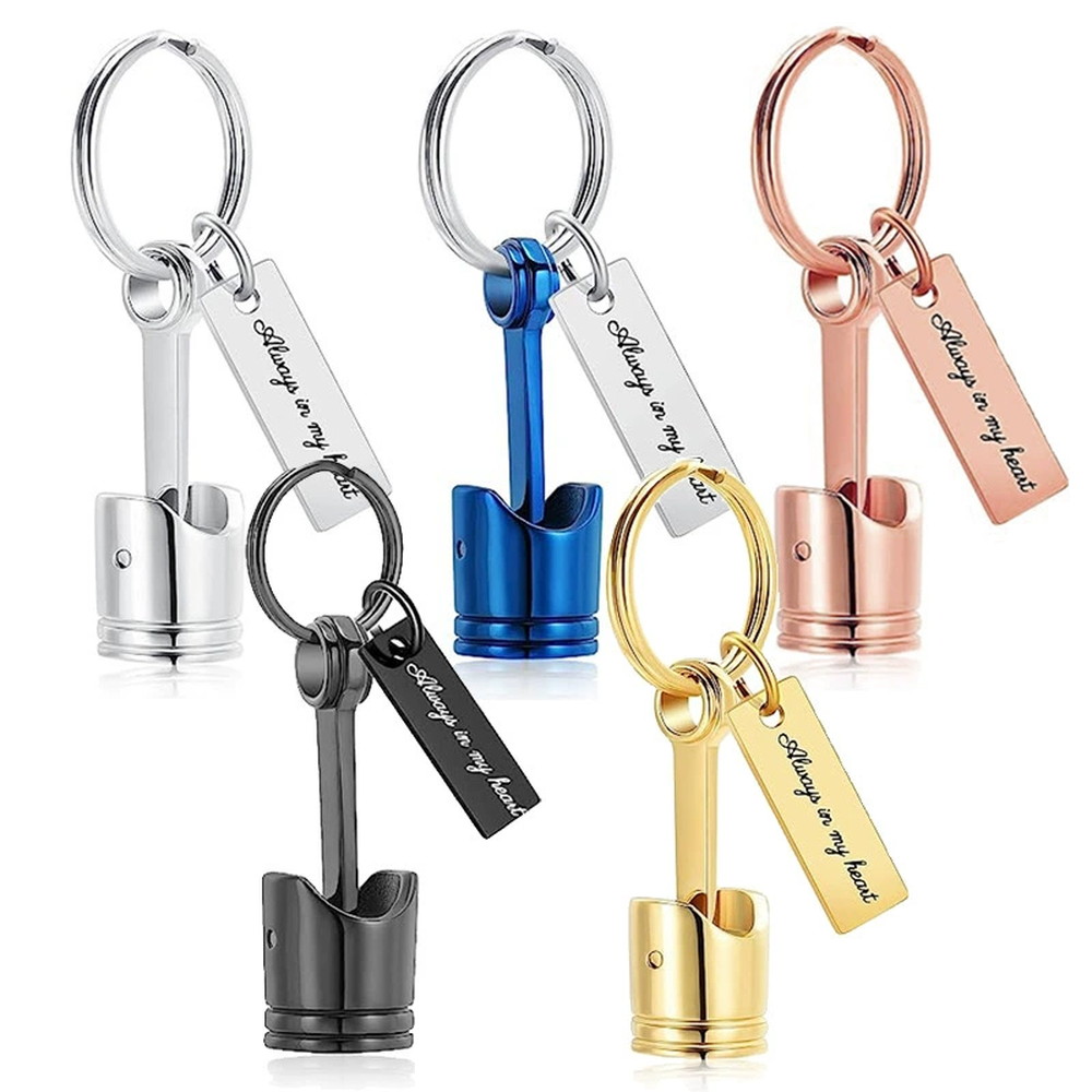 Chrome metal piston keychain shown in five finishes: silver, blue, rose gold, black and gold