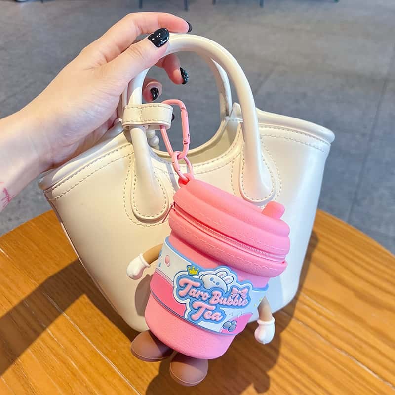 hand holding the rabbit milk tea cup keychain