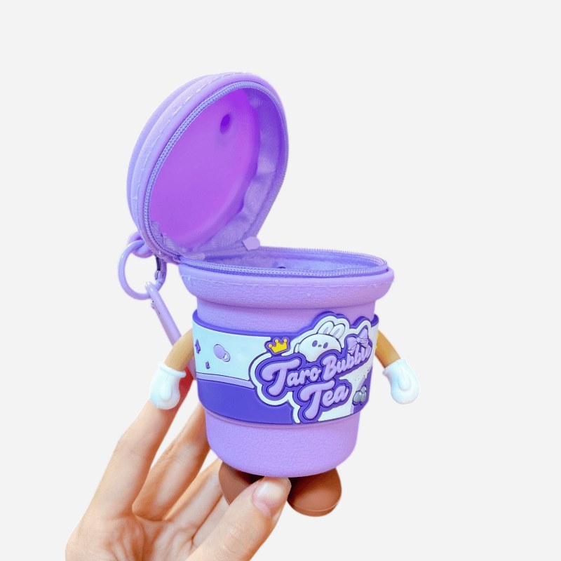 hand holding an open purple milk tea cup keychain showing the inner pocket