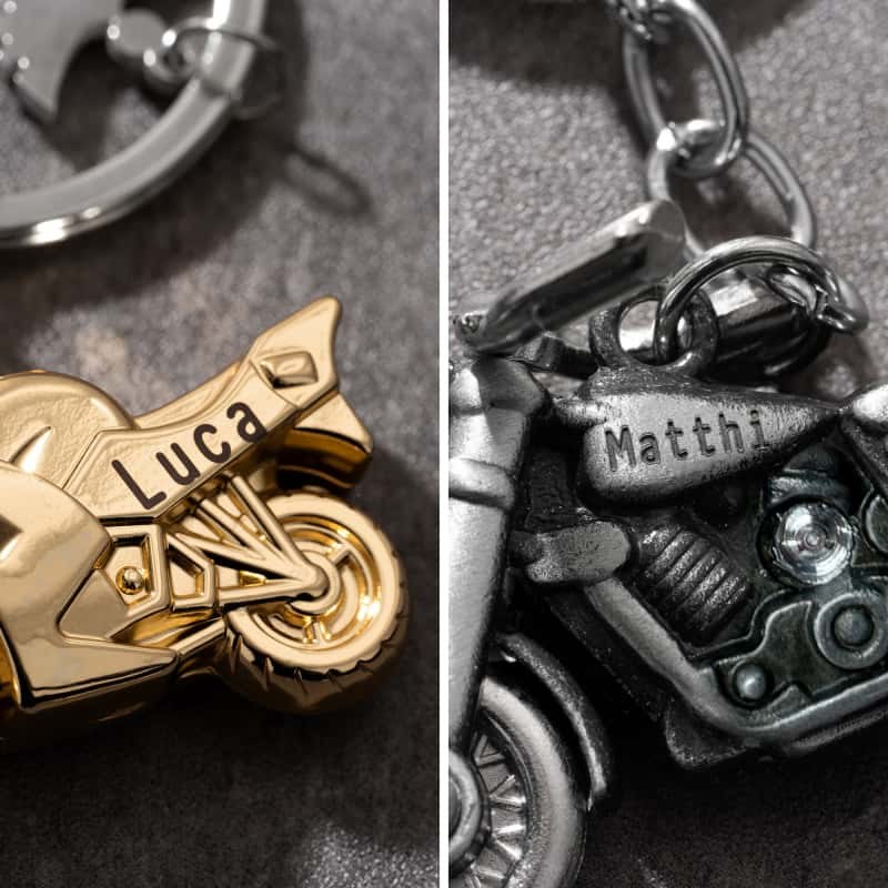 Custom engraved motorcycle metal keychains with rider names on the tank