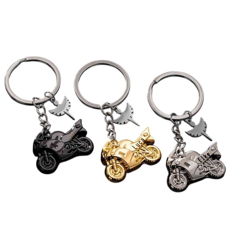 Motorcycle metal keychains in matte black, bright gold and bright silver with the angel-wing charm
