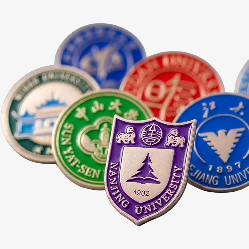 Stack of custom metal badges with multicolor shield enamel designs