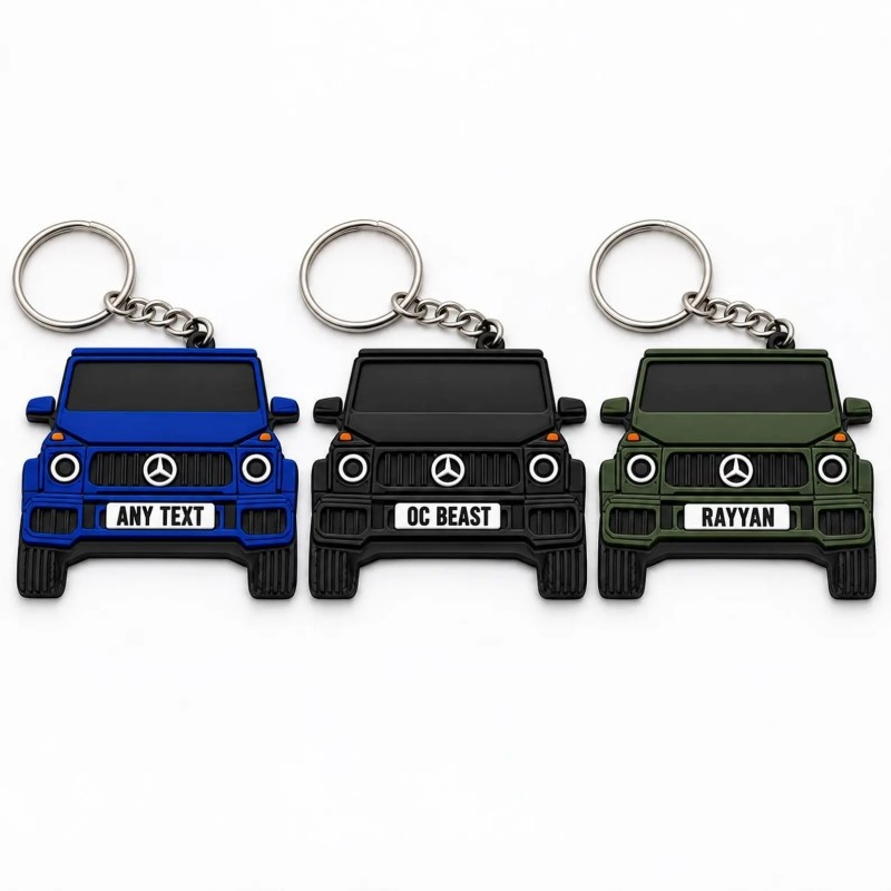 Three PVC car keychains in blue, black and army green with custom text on the number plate