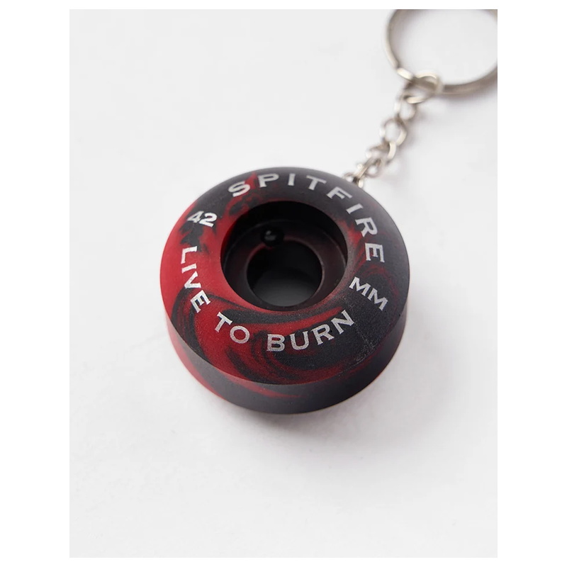 Red and black swirl spitfire wheel keychain detail with printed face