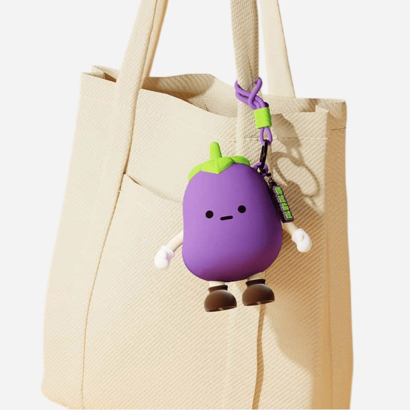 vegetable silicone keychain clipped to a canvas tote bag