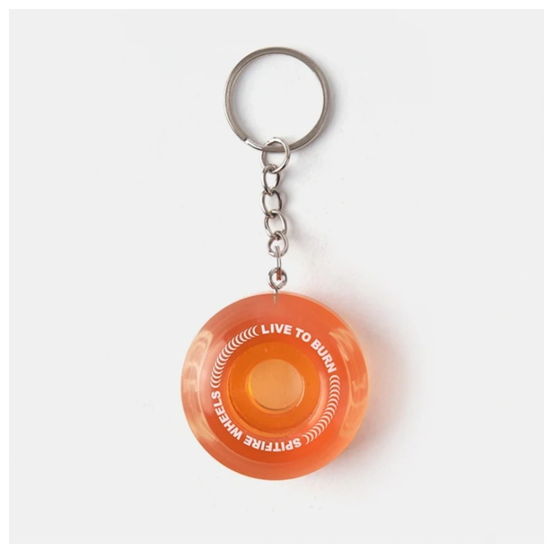 Single transparent orange spitfire wheel keychain with a metal ring