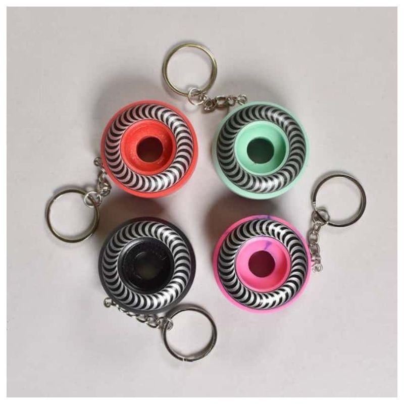 Assorted color spitfire wheel keychains with spiral swirl prints and metal rings