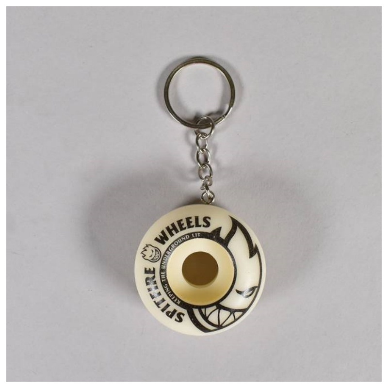 Natural cream spitfire wheel keychain with a black sidewall graphic, metal ring and chain