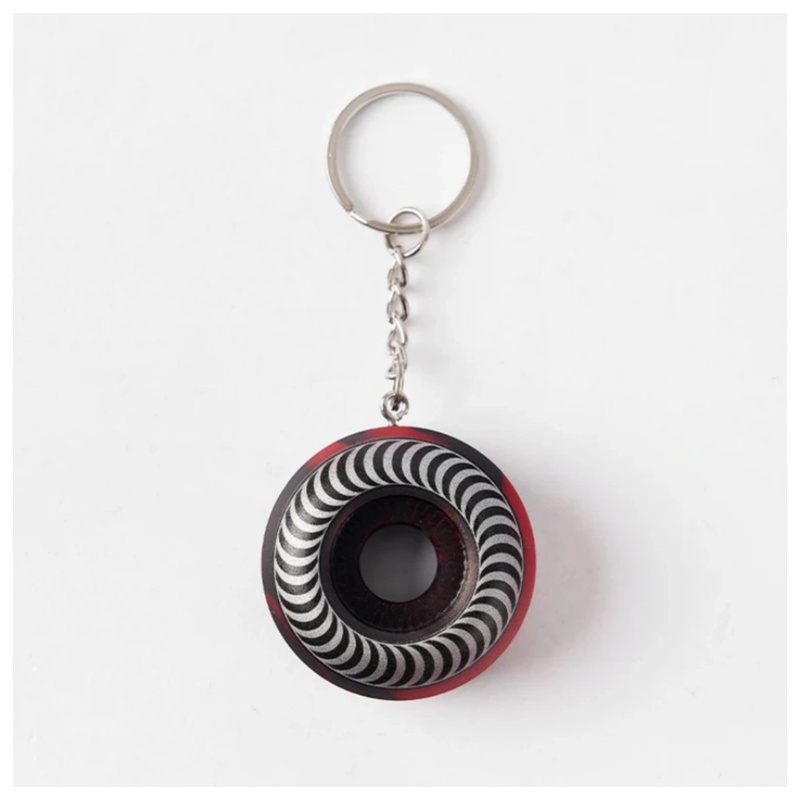 Swirl pattern spitfire wheel keychain top view with the full metal ring