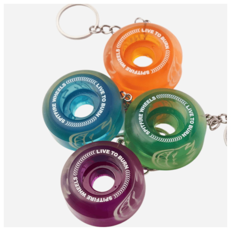 Transparent multi-color spitfire wheel keychains grouped together on white