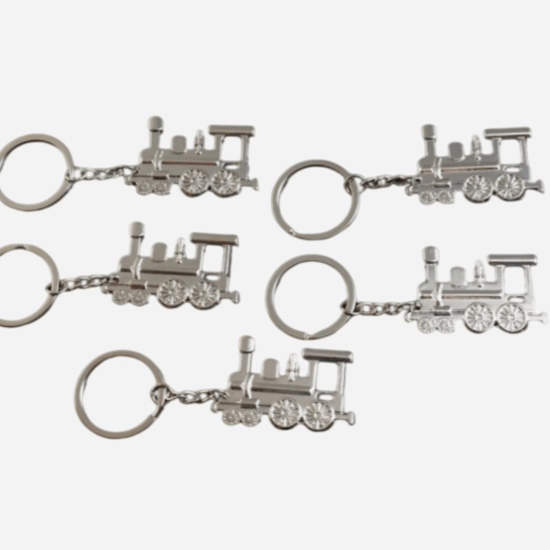 Vintage train keychains lined up in a row for the packing check