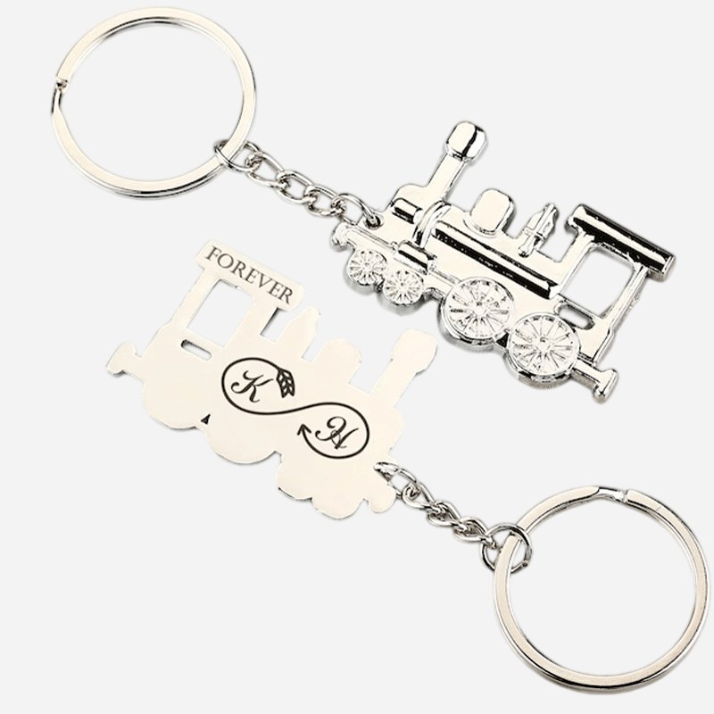 Matte black vintage train keychain hanging from its split ring
