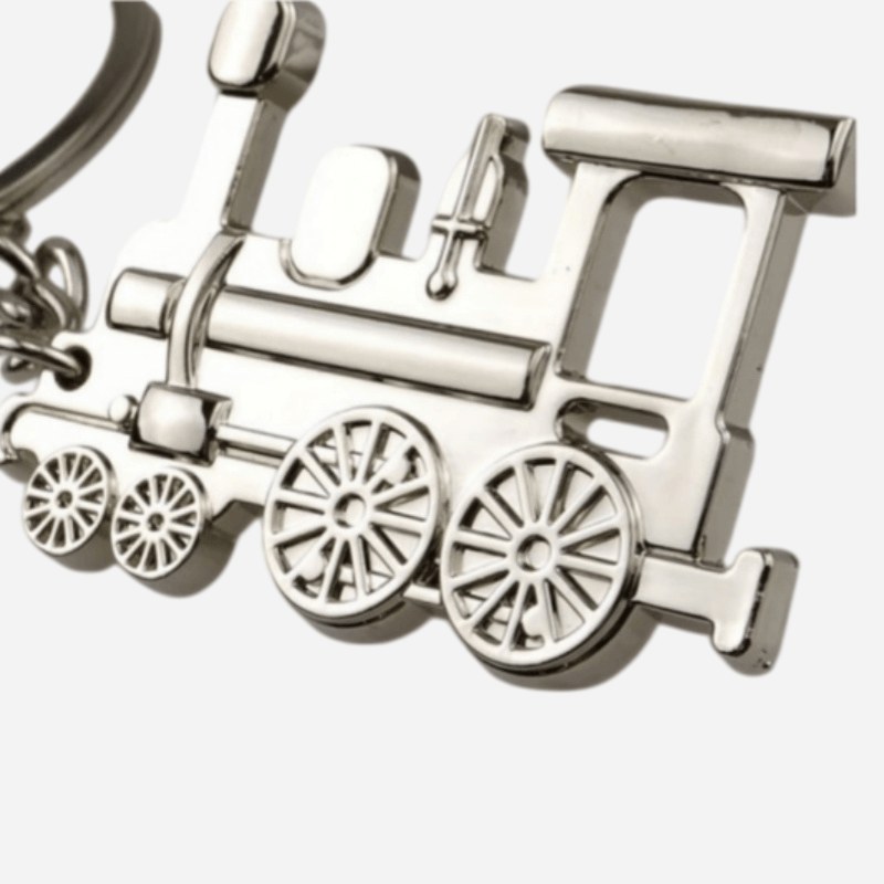 Close-up of the embossed wheels and boiler on the vintage train keychain