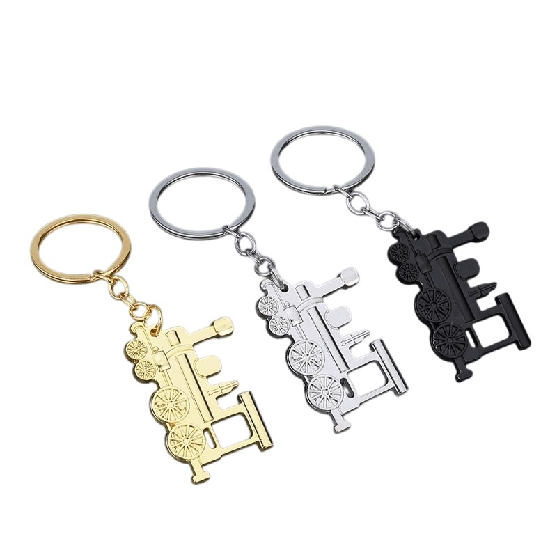 Vintage train keychains in gold, bright silver and matte black finishes